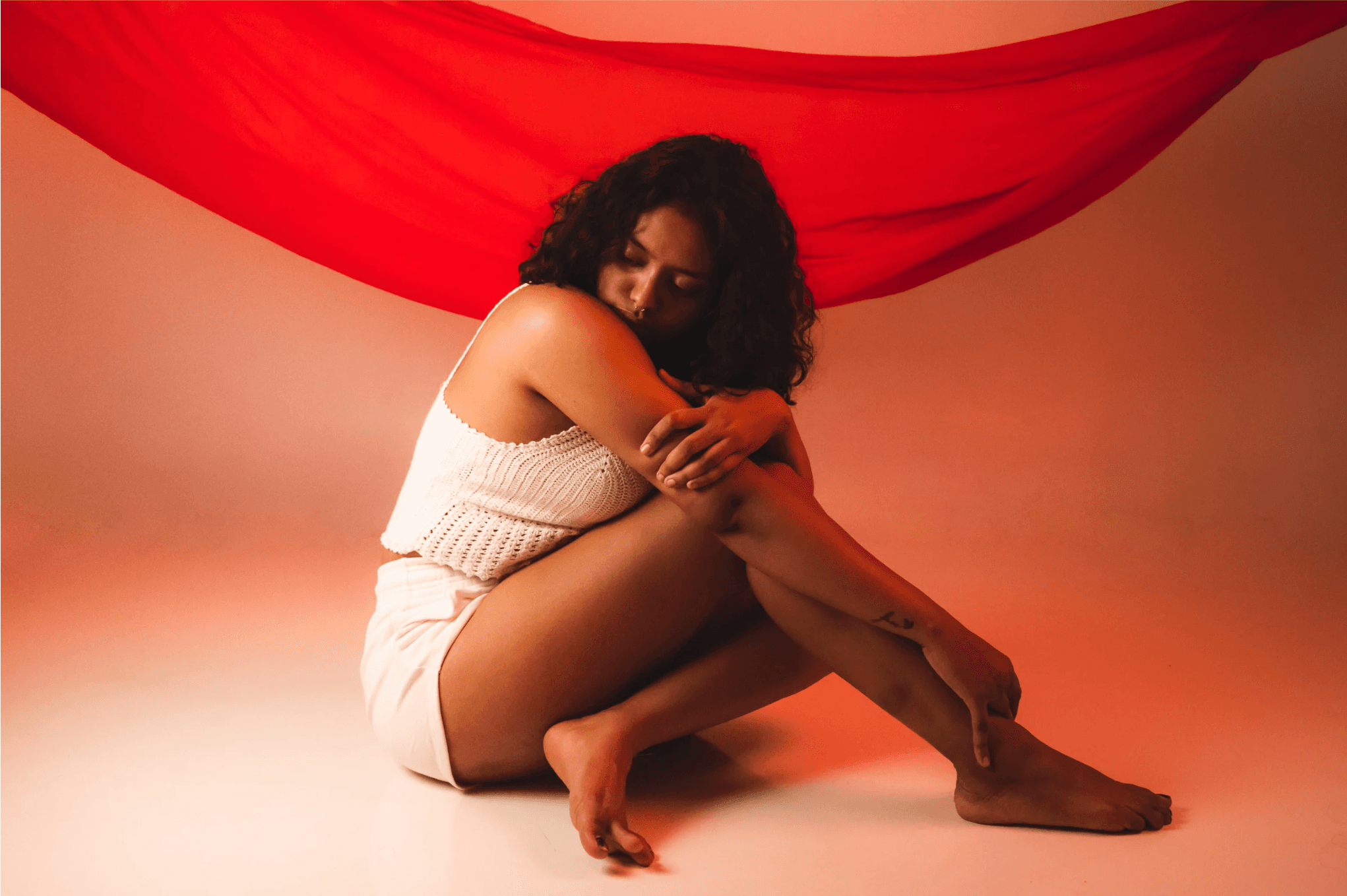 Woman with red fabric